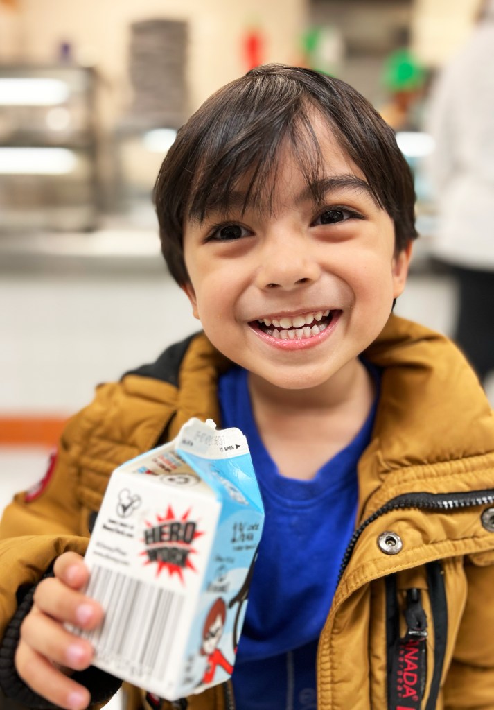 smiling kid with milk