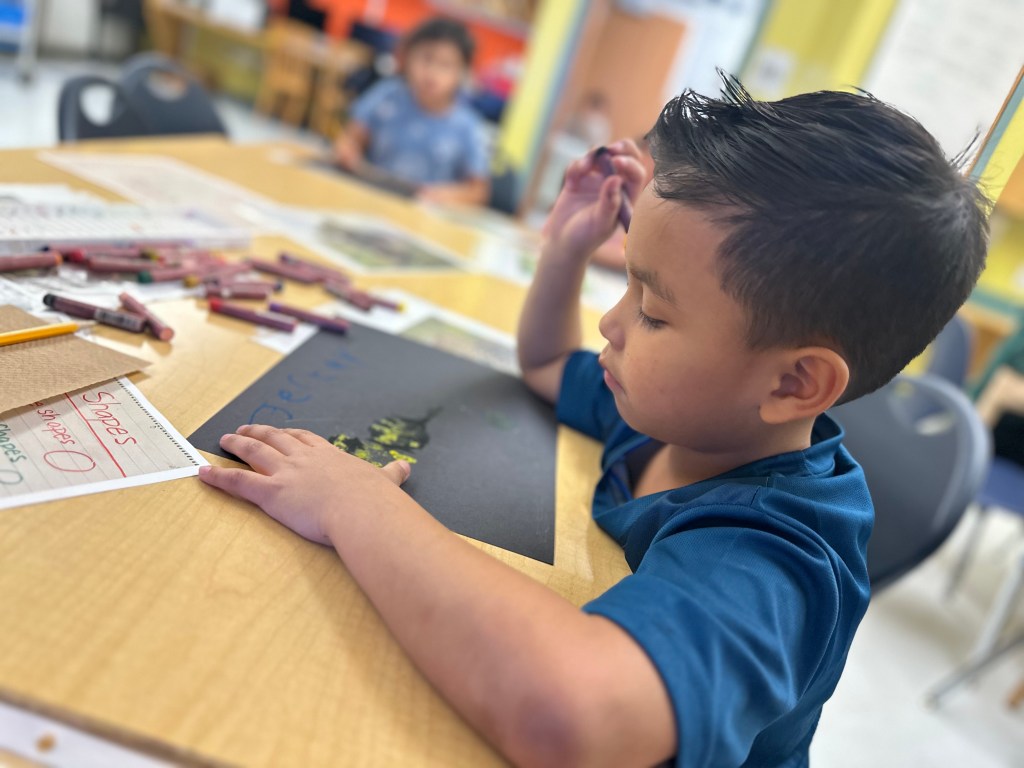 student working on art