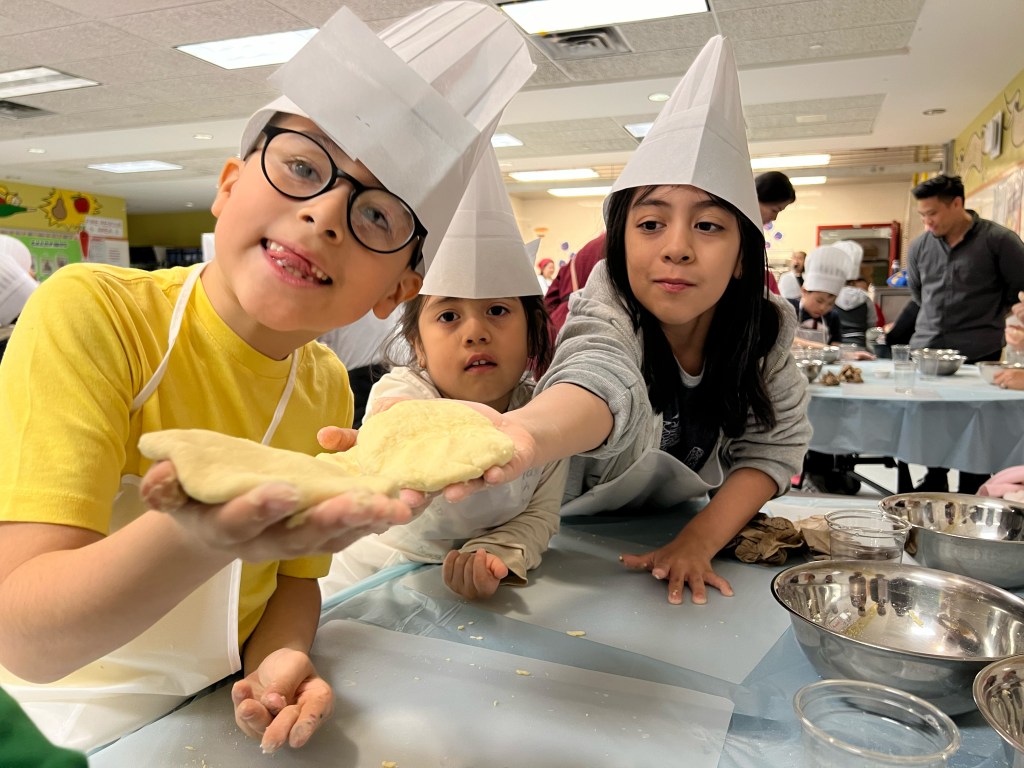 kids offering cooked food
