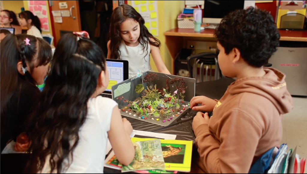 students presenting a model