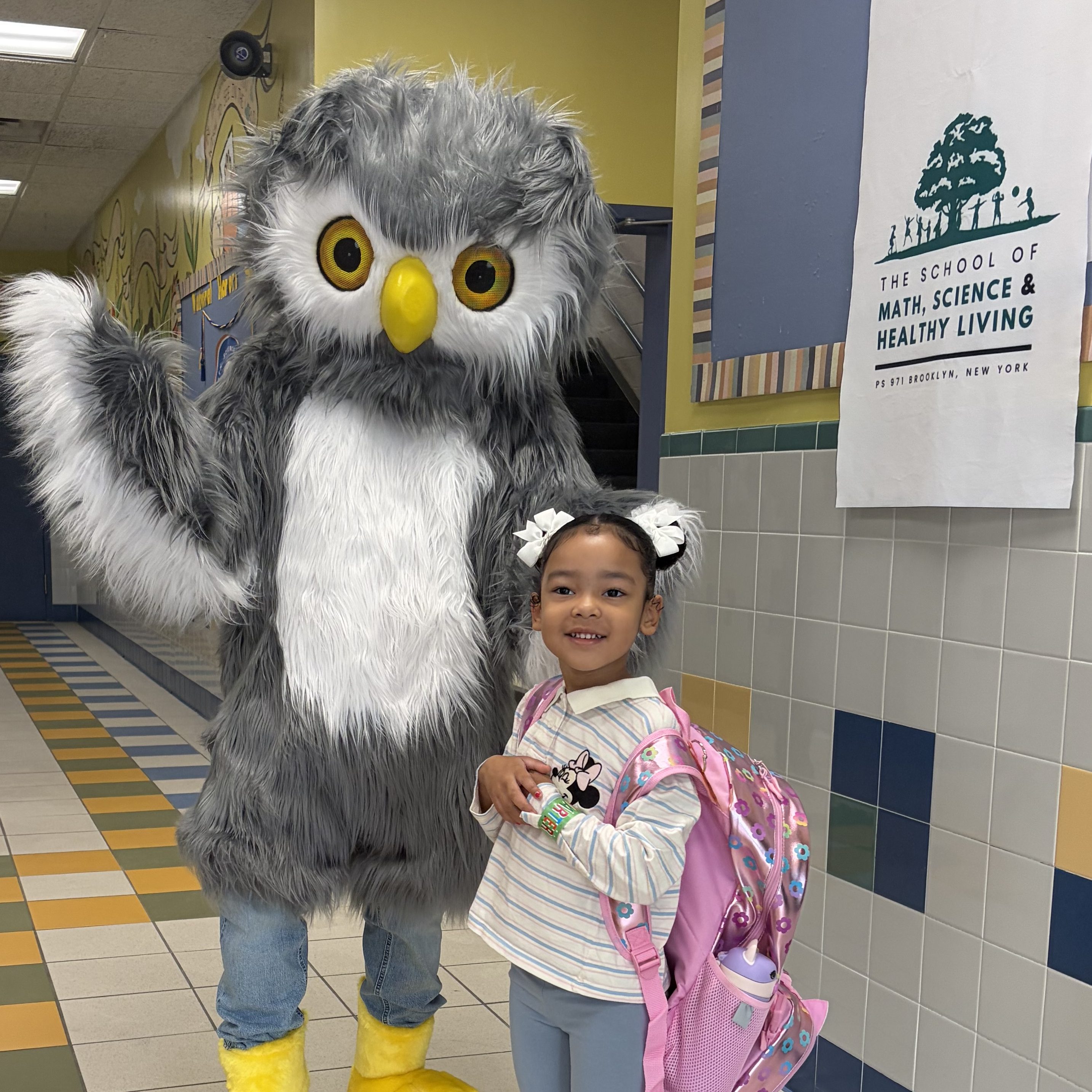 indoor owl greets kid