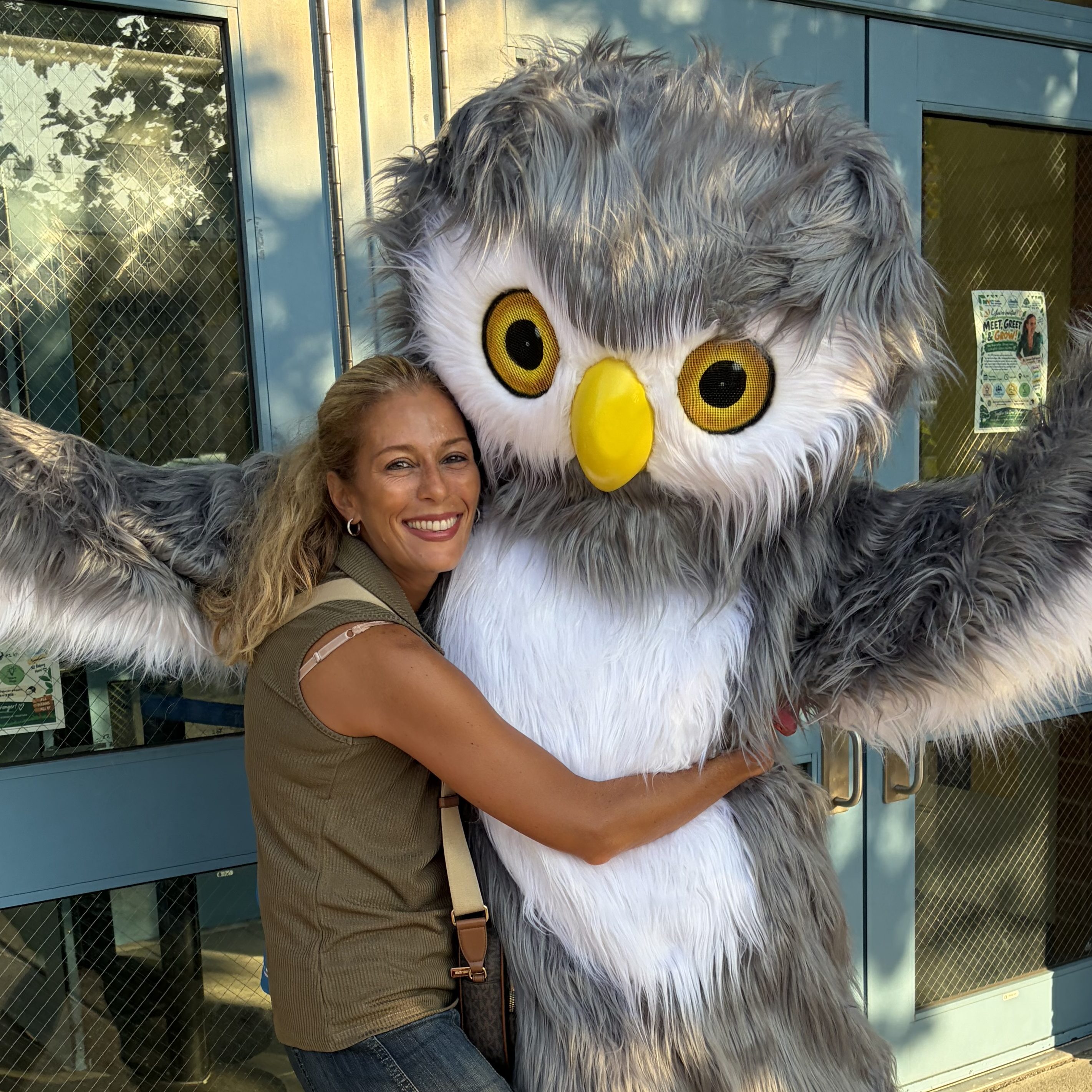 teacher hugs owl